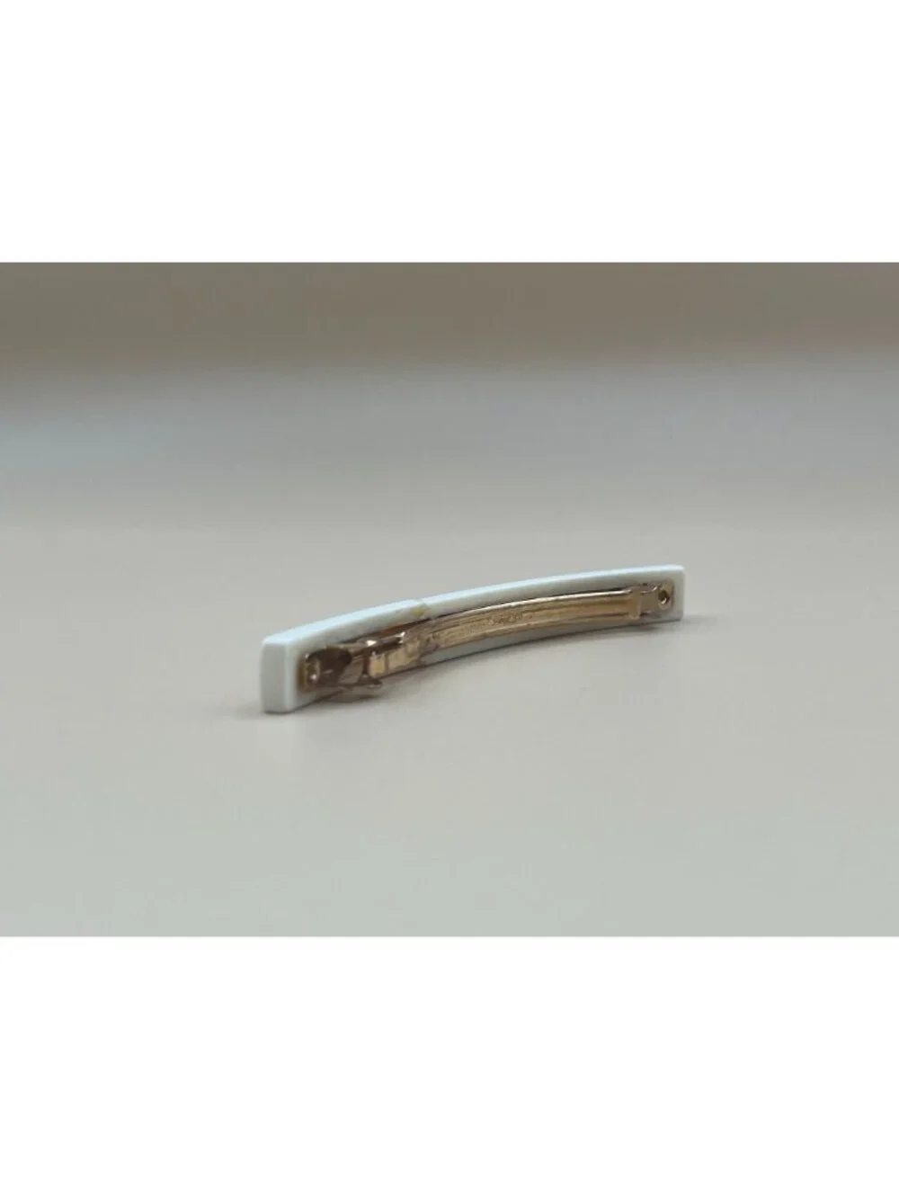 Authentic vintage Chanel bar barrette in cream-white resin, printed with two red